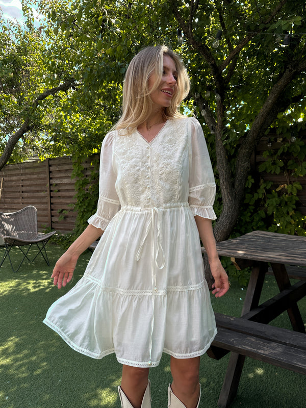 Dress with embroidery in white